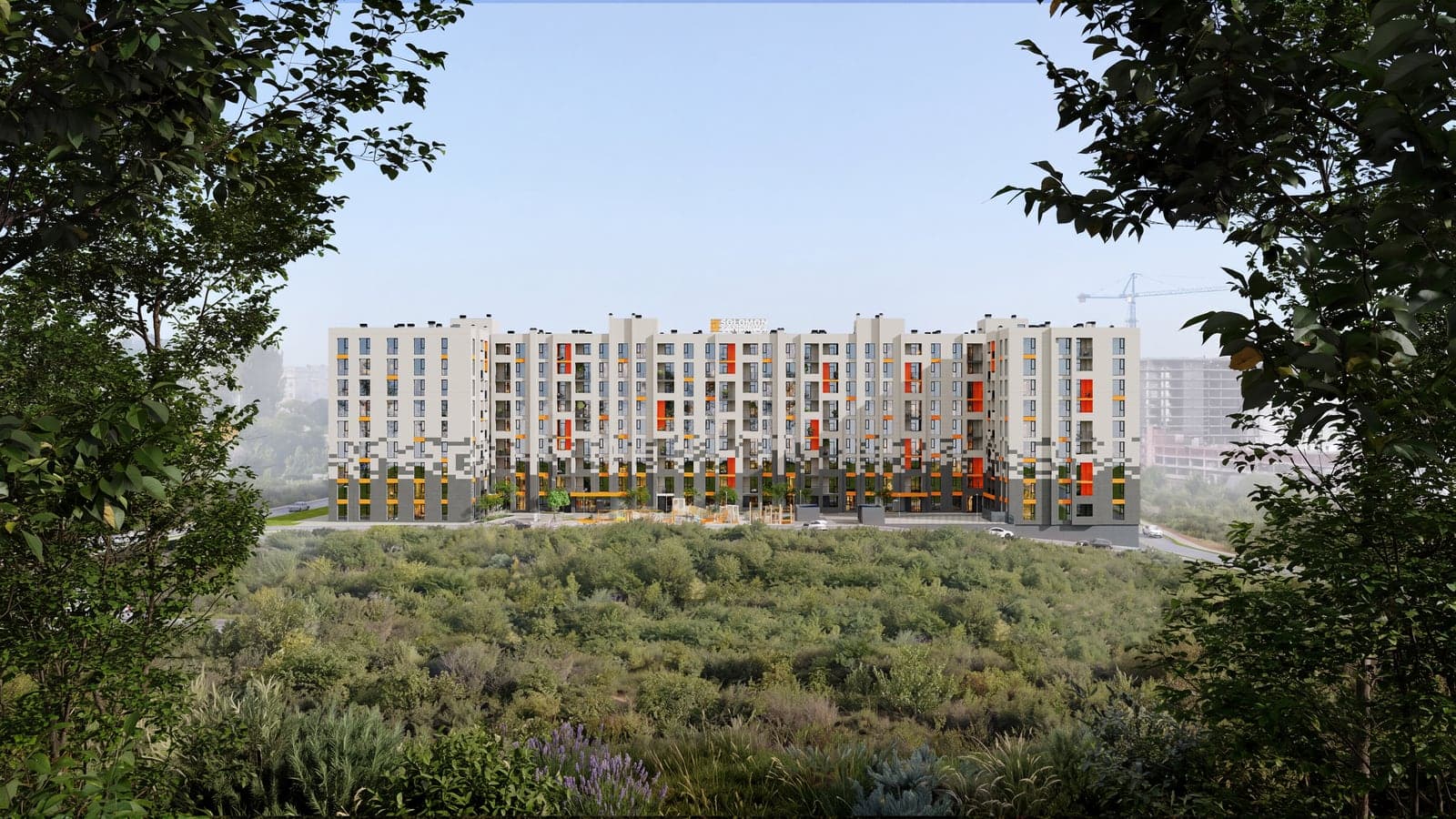 Clădirea Favorit Residence 3 la amurg, încadrată de copaci